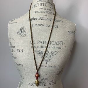 Gold colored necklace with 3 stones